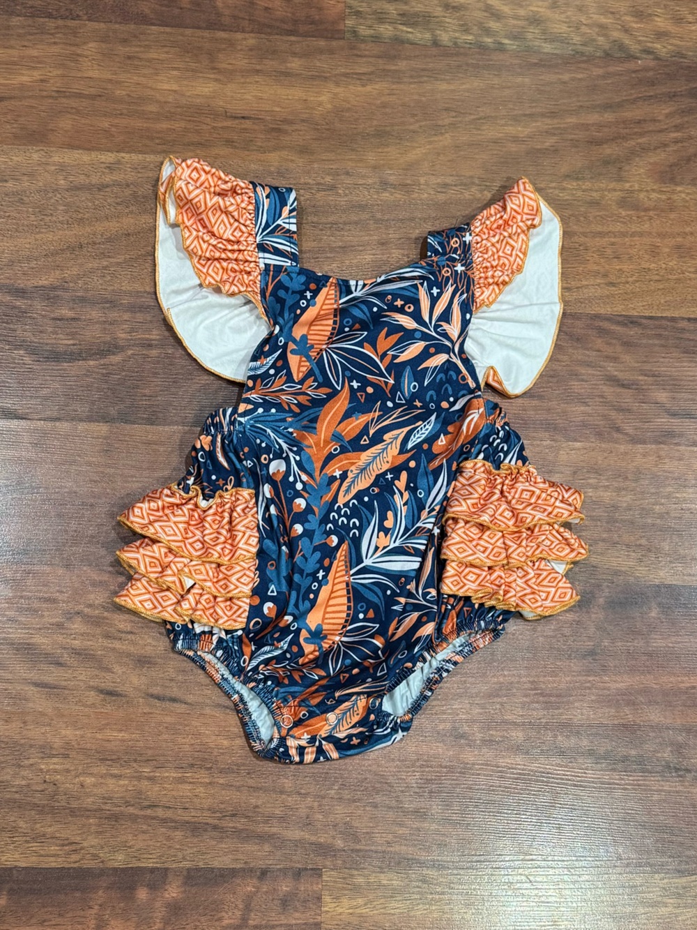 Pete + Lucy - Navy and Orange Floral Ruffle One-Piece Bubble Romper with Ruffles